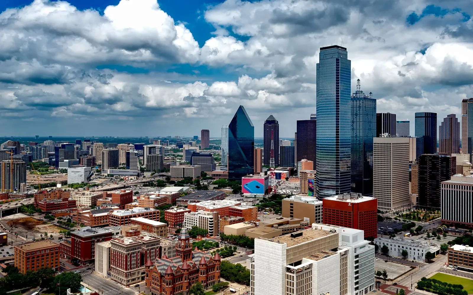 Downtown Dallas under cumulus clouds.